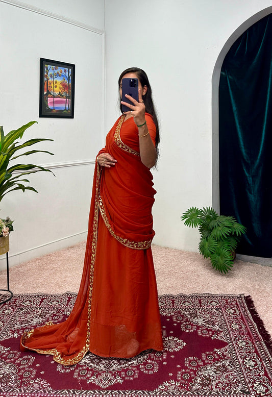 Good Looking Embroidery Work Orange Color Saree Gown
