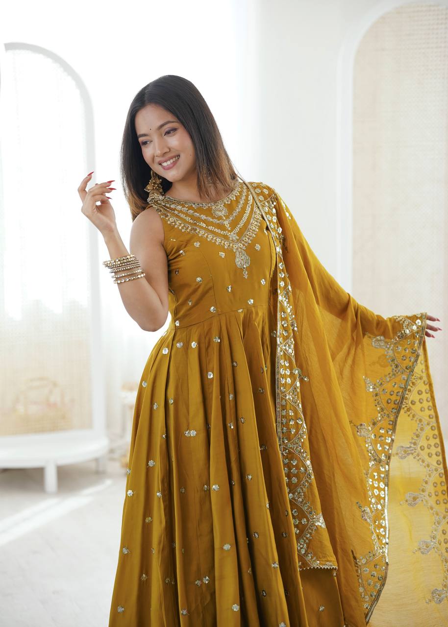 Haldi Wear Mustard Color Roman Silk Arti Chauhan Anarkali Gown Set