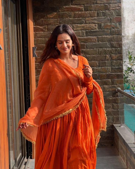 Peaceful Orange Color Chinnon Silk Anarkali Gown