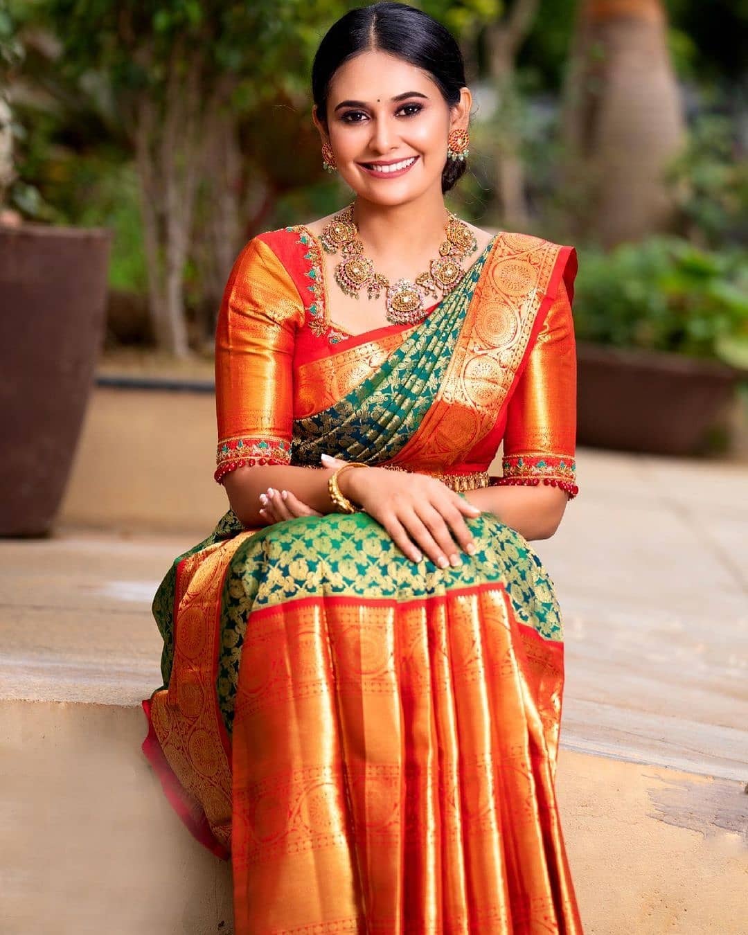 Fabulous Red And Green Peacock Design Saree