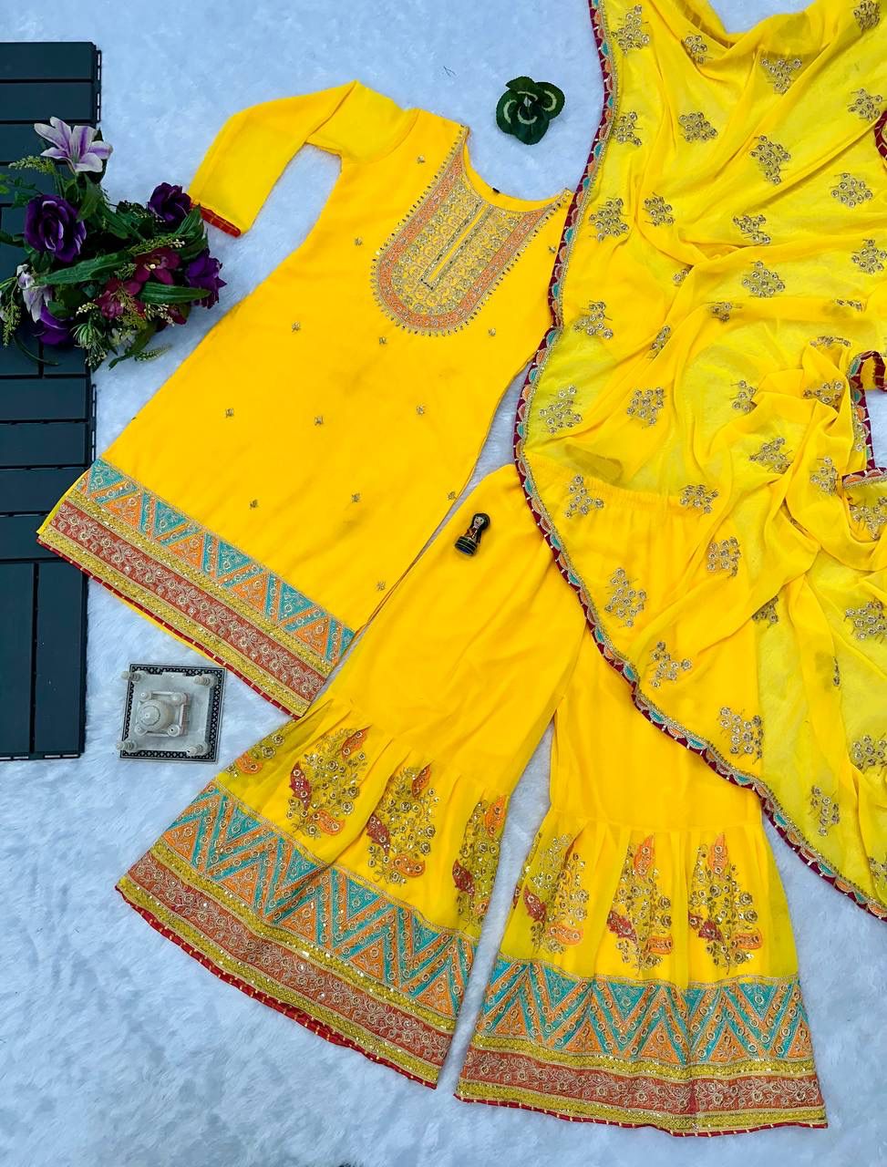 Mirror With Embroidery Work Yellow Color Sharara Suit