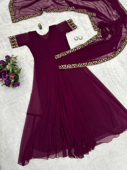Good Looking Embroidery Work Wine Color Saree Gown