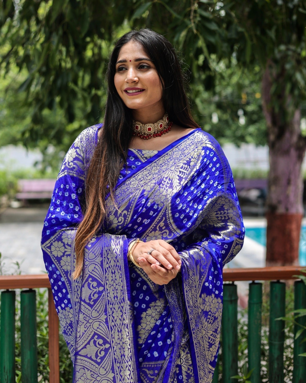 Trendy Zari Weaving Border Blue Color Pure Bandhani Saree