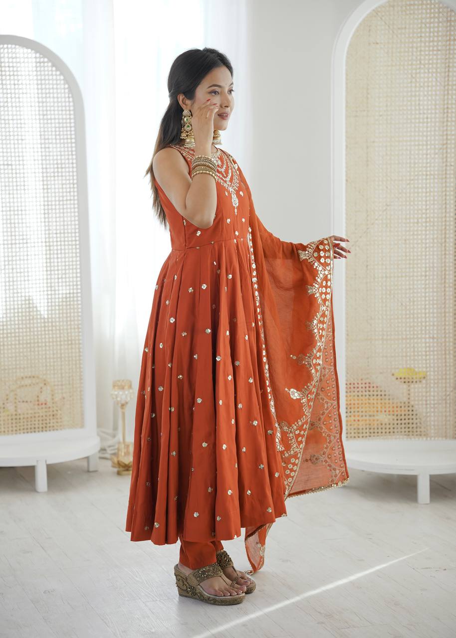Wedding Wear Orange Color Roman Silk Arti Chauhan Anarkali Gown Set