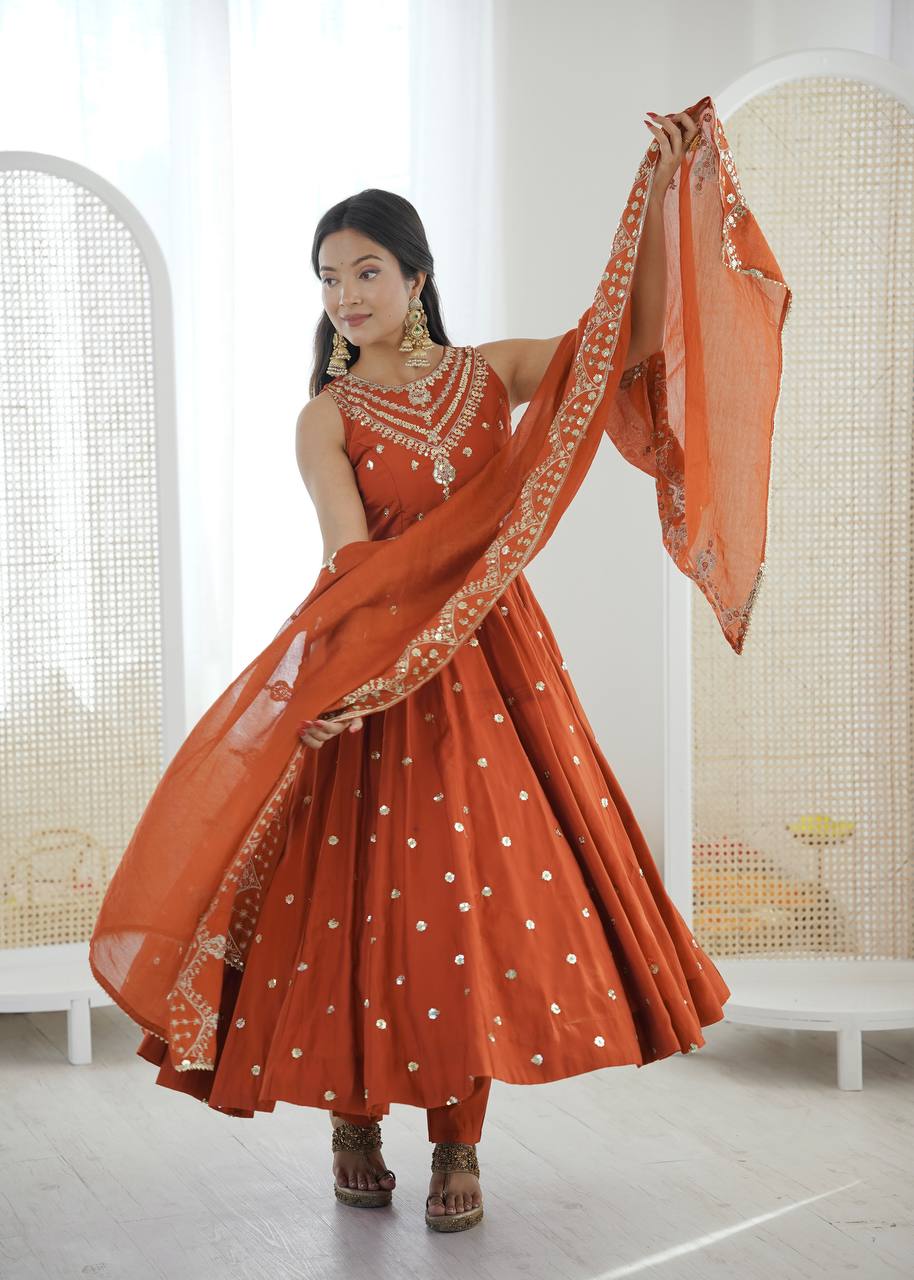 Wedding Wear Orange Color Roman Silk Arti Chauhan Anarkali Gown Set