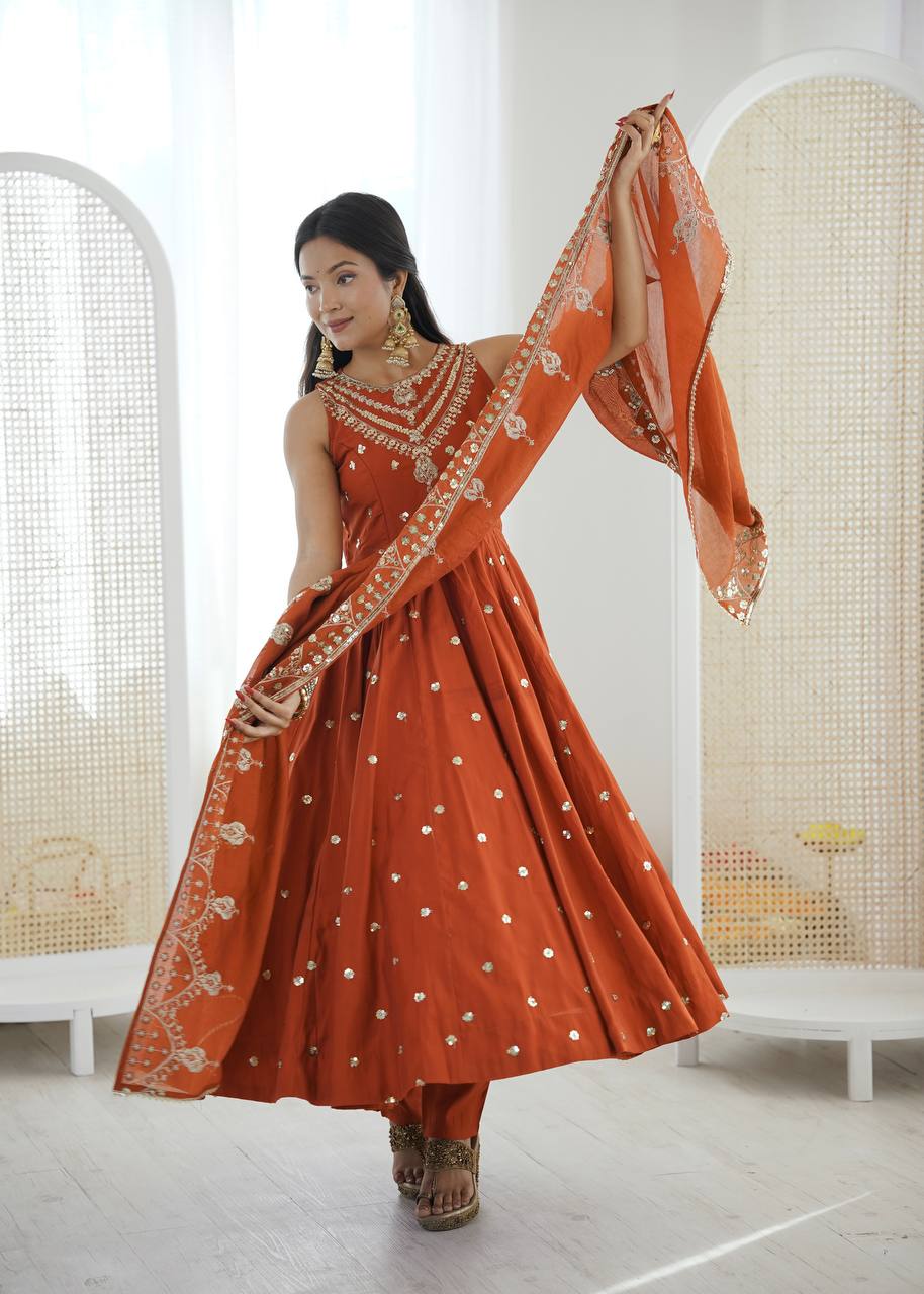 Wedding Wear Orange Color Roman Silk Arti Chauhan Anarkali Gown Set