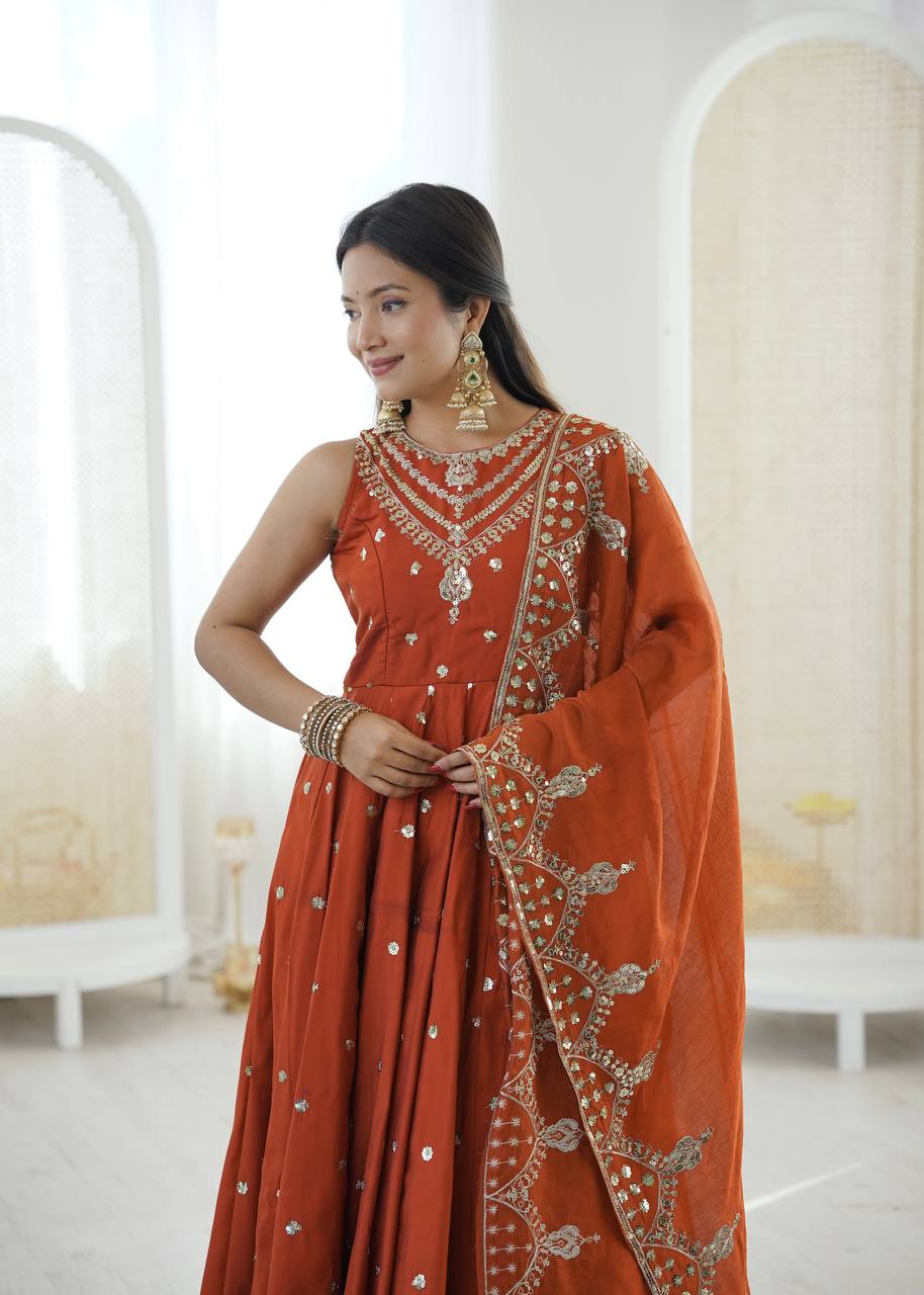 Wedding Wear Orange Color Roman Silk Arti Chauhan Anarkali Gown Set