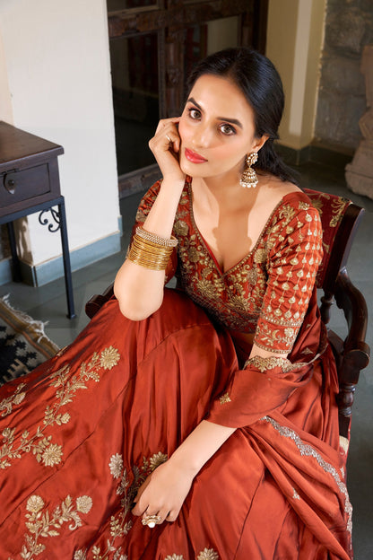 Party Wear Orange Color Rangoli Silk Sequins And Thread Embroidery Work Lehenga Choli