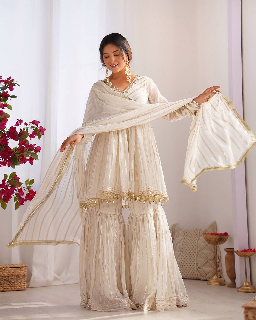 Arti Chauhan's Off White Color Mirror With Handwork Designer Sharara Suit