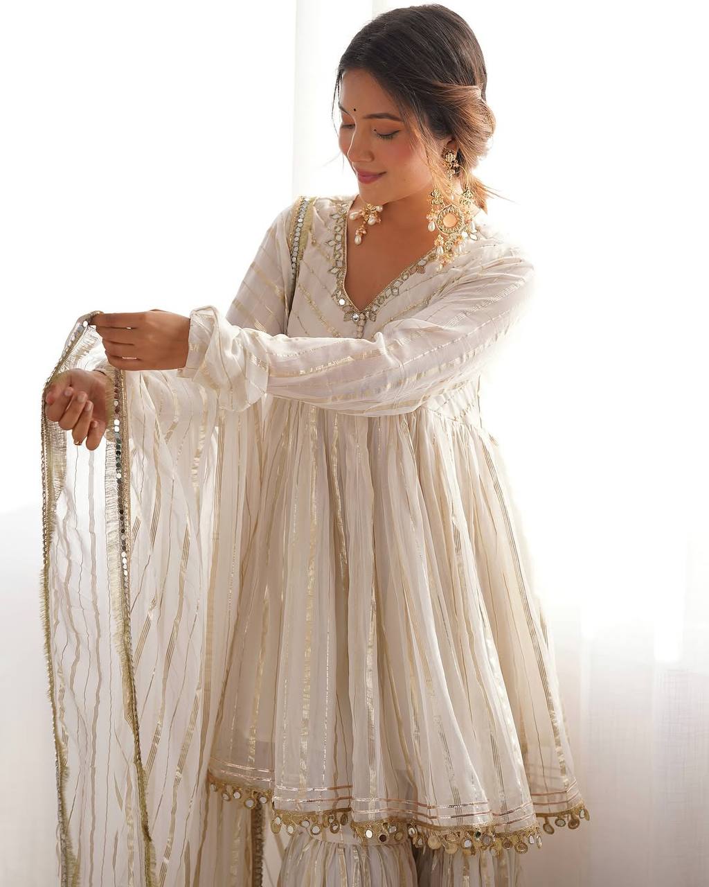 Arti Chauhan's Off White Color Mirror With Handwork Designer Sharara Suit