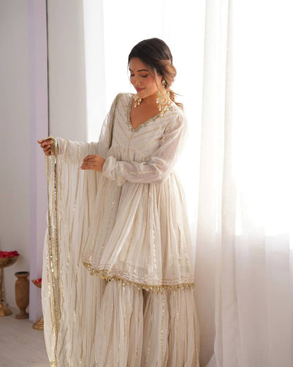 Arti Chauhan's Off White Color Mirror With Handwork Designer Sharara Suit