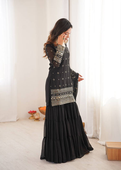 Arti Chauhan Black Color Georgette Top With Ruffle Sharara And Dupatta Set