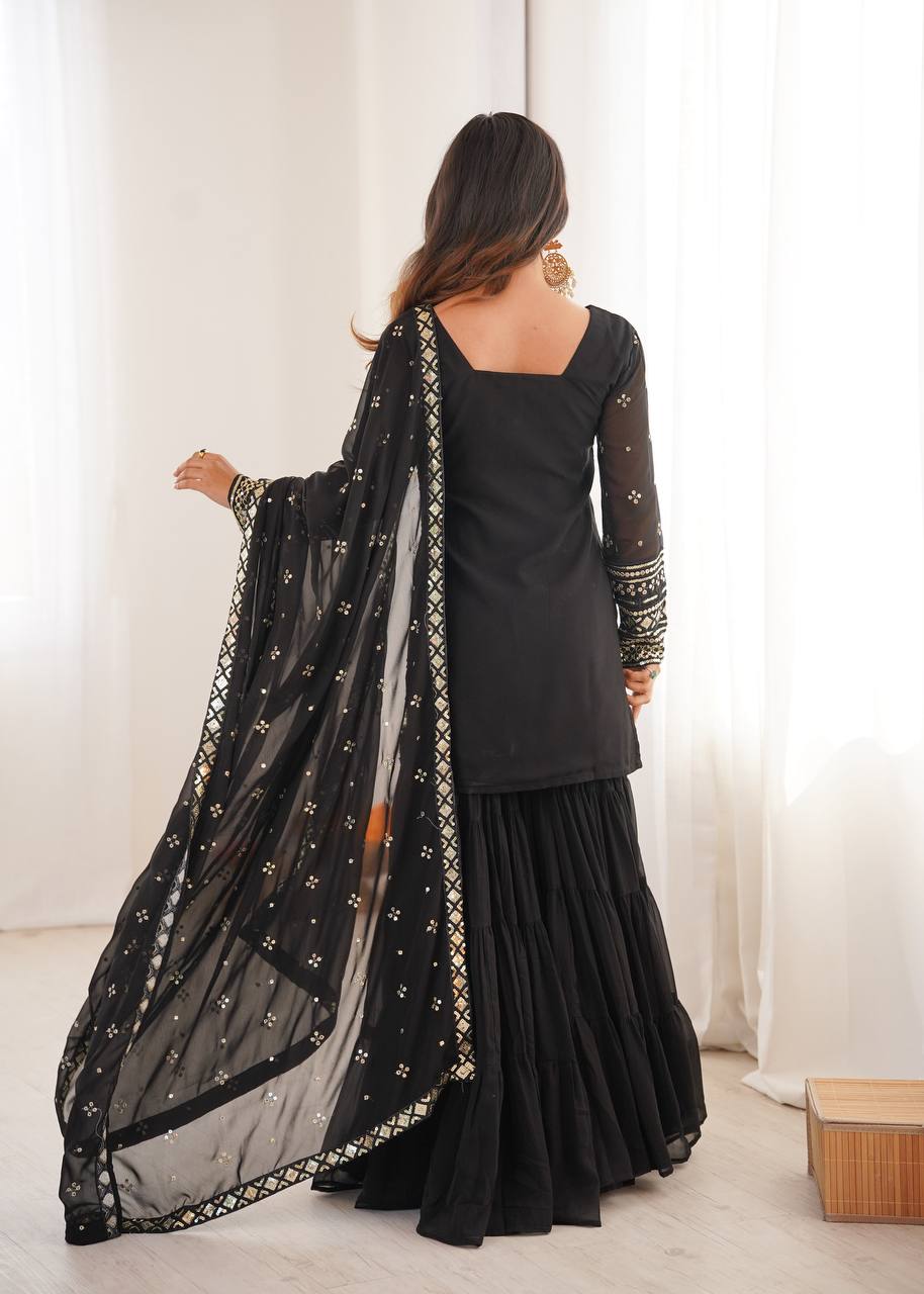 Arti Chauhan Black Color Georgette Top With Ruffle Sharara And Dupatta Set