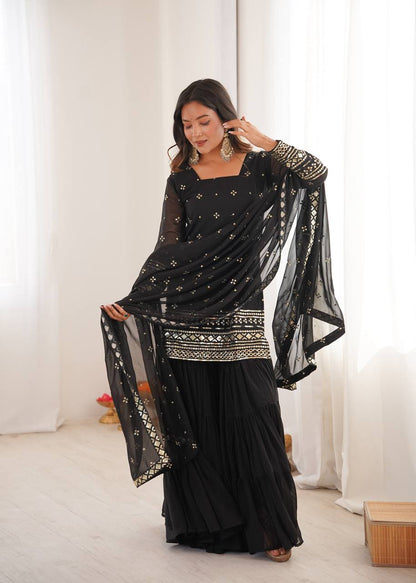 Arti Chauhan Black Color Georgette Top With Ruffle Sharara And Dupatta Set