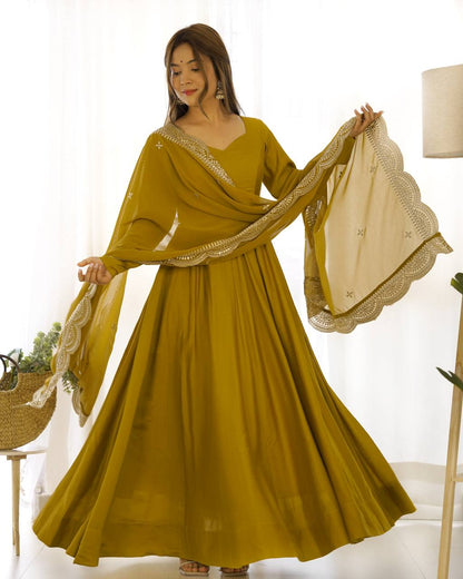 Party Wear Mustard Color Heavy Pure Roman Silk Plain Designer Gown With Work Dupatta