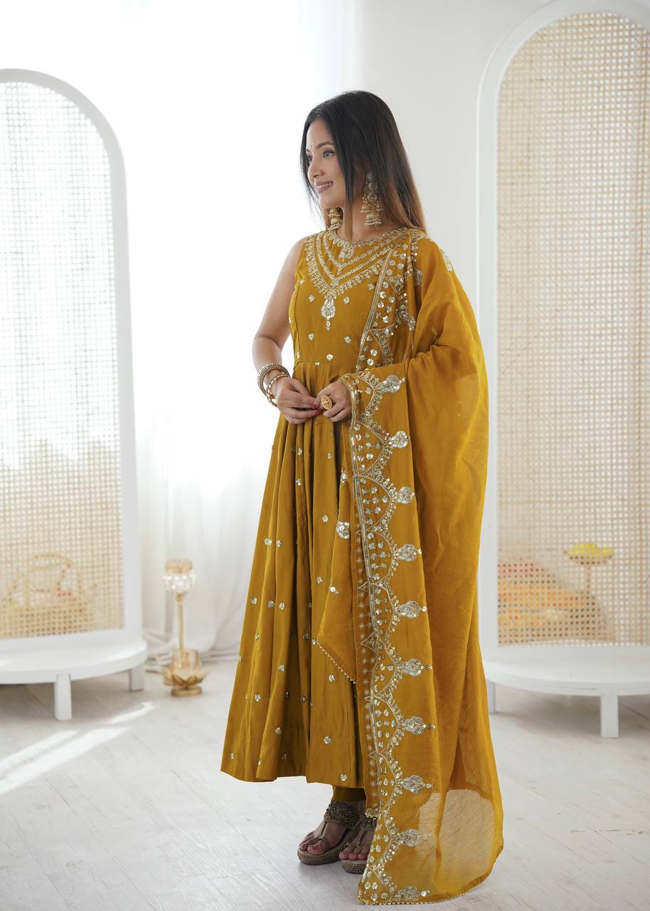Haldi Wear Mustard Color Roman Silk Arti Chauhan Anarkali Gown Set