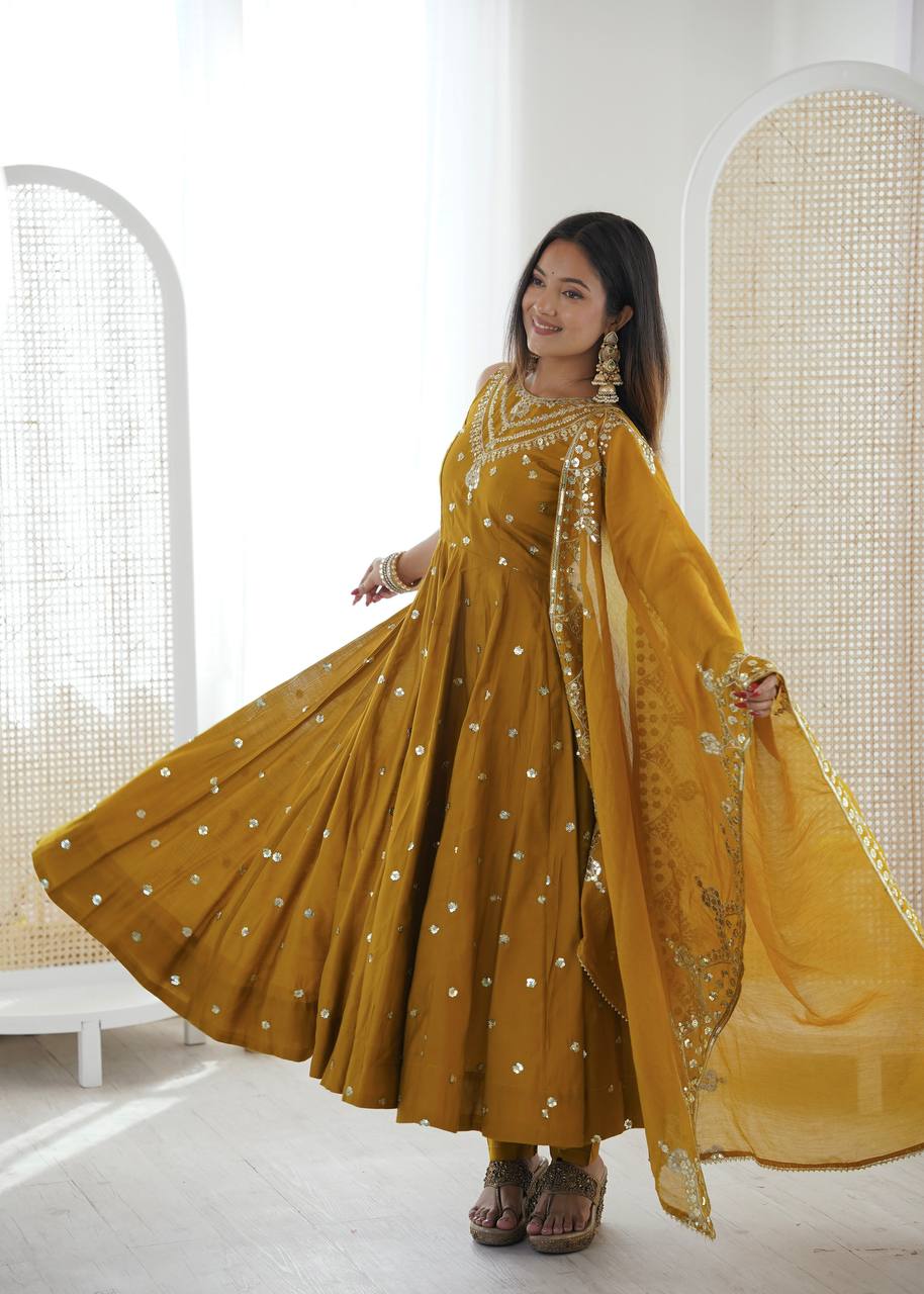 Haldi Wear Mustard Color Roman Silk Arti Chauhan Anarkali Gown Set