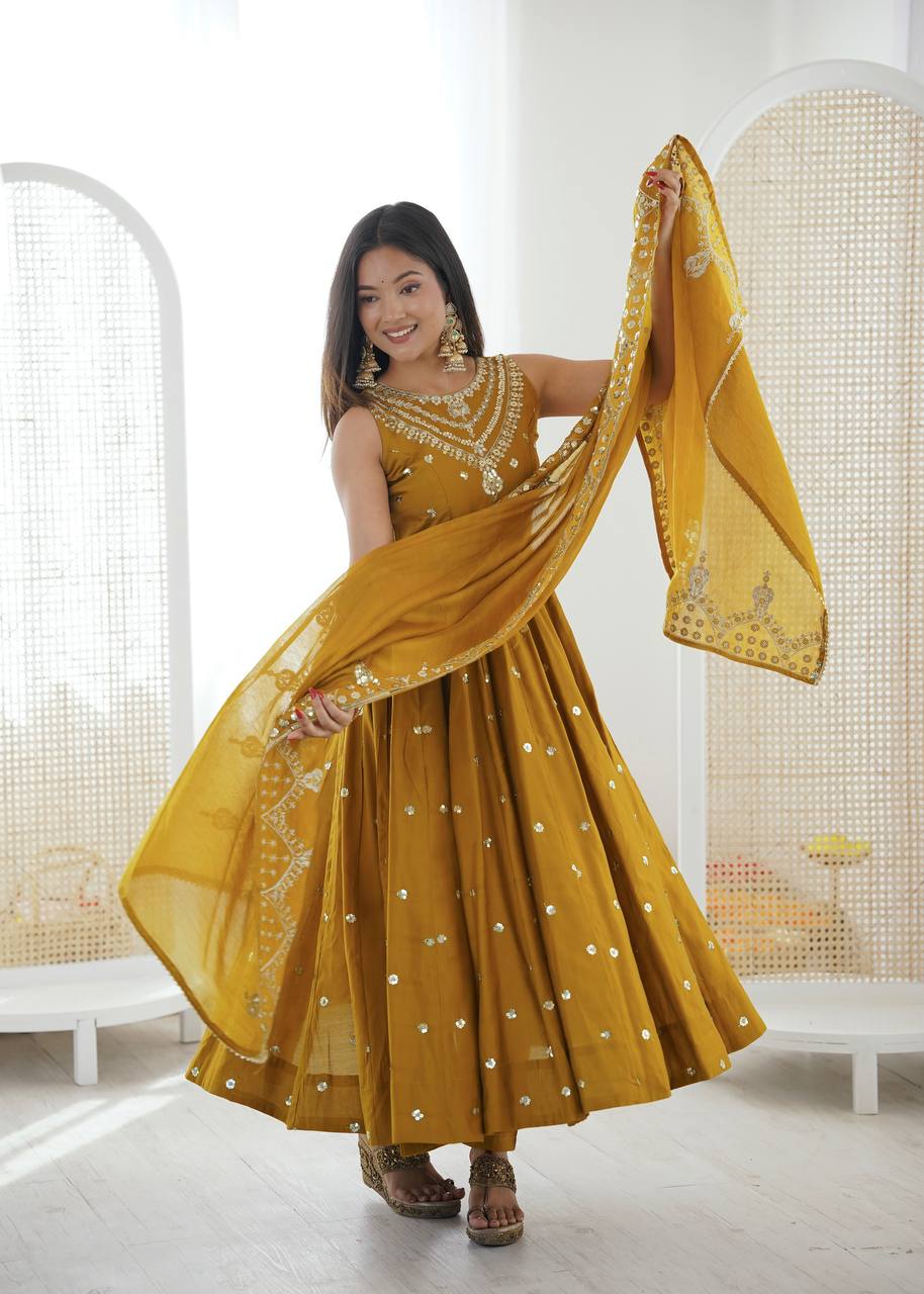 Haldi Wear Mustard Color Roman Silk Arti Chauhan Anarkali Gown Set