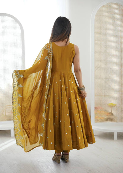Haldi Wear Mustard Color Roman Silk Arti Chauhan Anarkali Gown Set