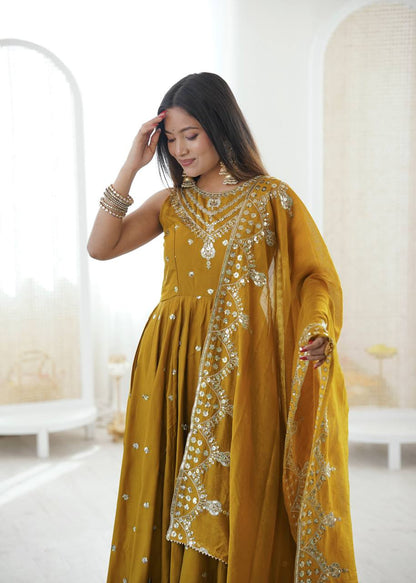 Haldi Wear Mustard Color Roman Silk Arti Chauhan Anarkali Gown Set