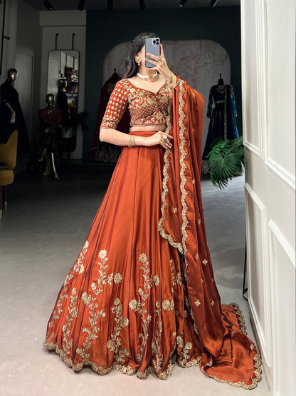 Wedding Wear Orange Color Rangoli Silk With Rich Texture Sequins And Thread Embroidery Work Lehenga Choli