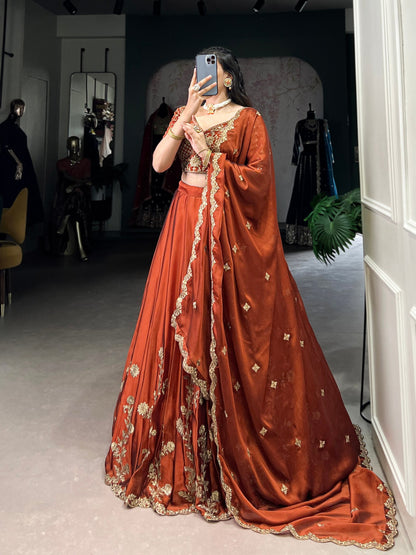 Wedding Wear Orange Color Rangoli Silk With Rich Texture Sequins And Thread Embroidery Work Lehenga Choli