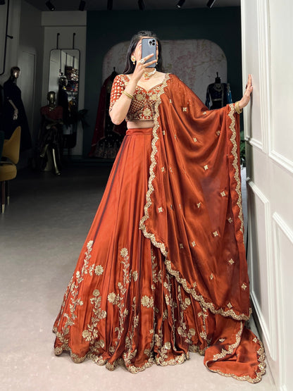 Wedding Wear Orange Color Rangoli Silk With Rich Texture Sequins And Thread Embroidery Work Lehenga Choli