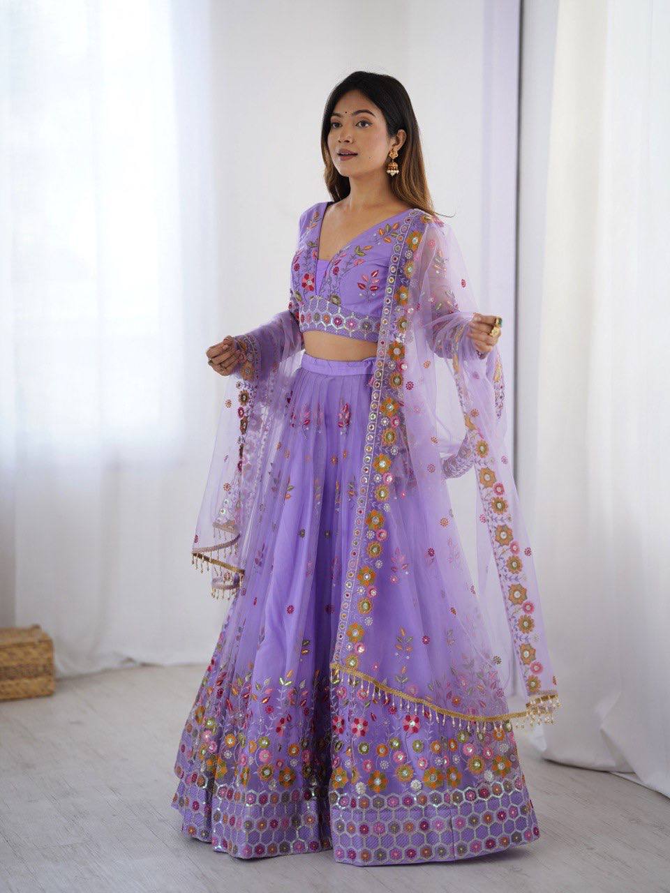 Party Wear Lavender Soft Net Intricate Thread And Sequin Embroidery Work Beautiful Lehenga Choli