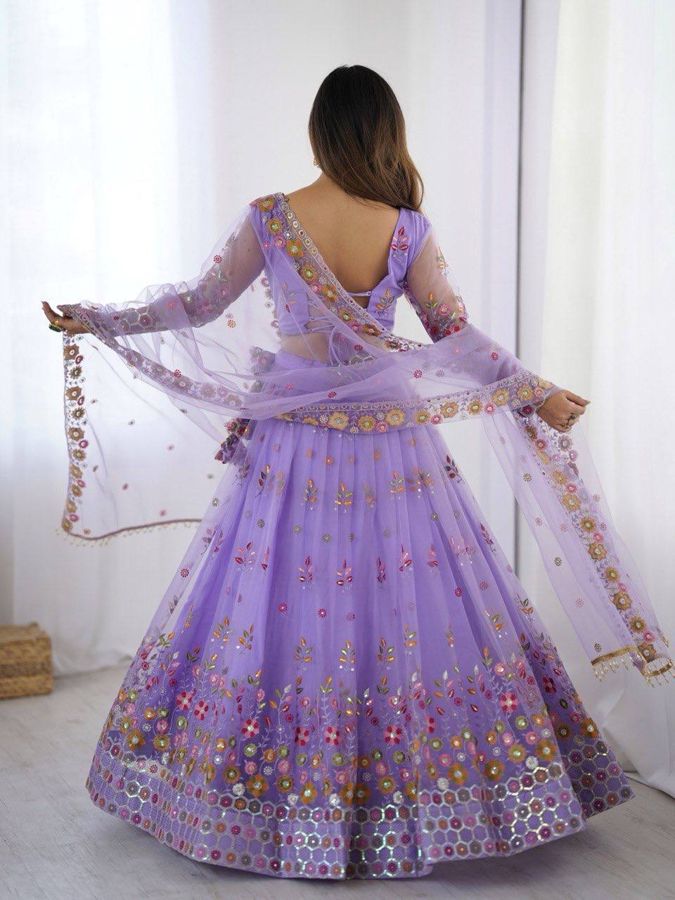 Party Wear Lavender Soft Net Intricate Thread And Sequin Embroidery Work Beautiful Lehenga Choli