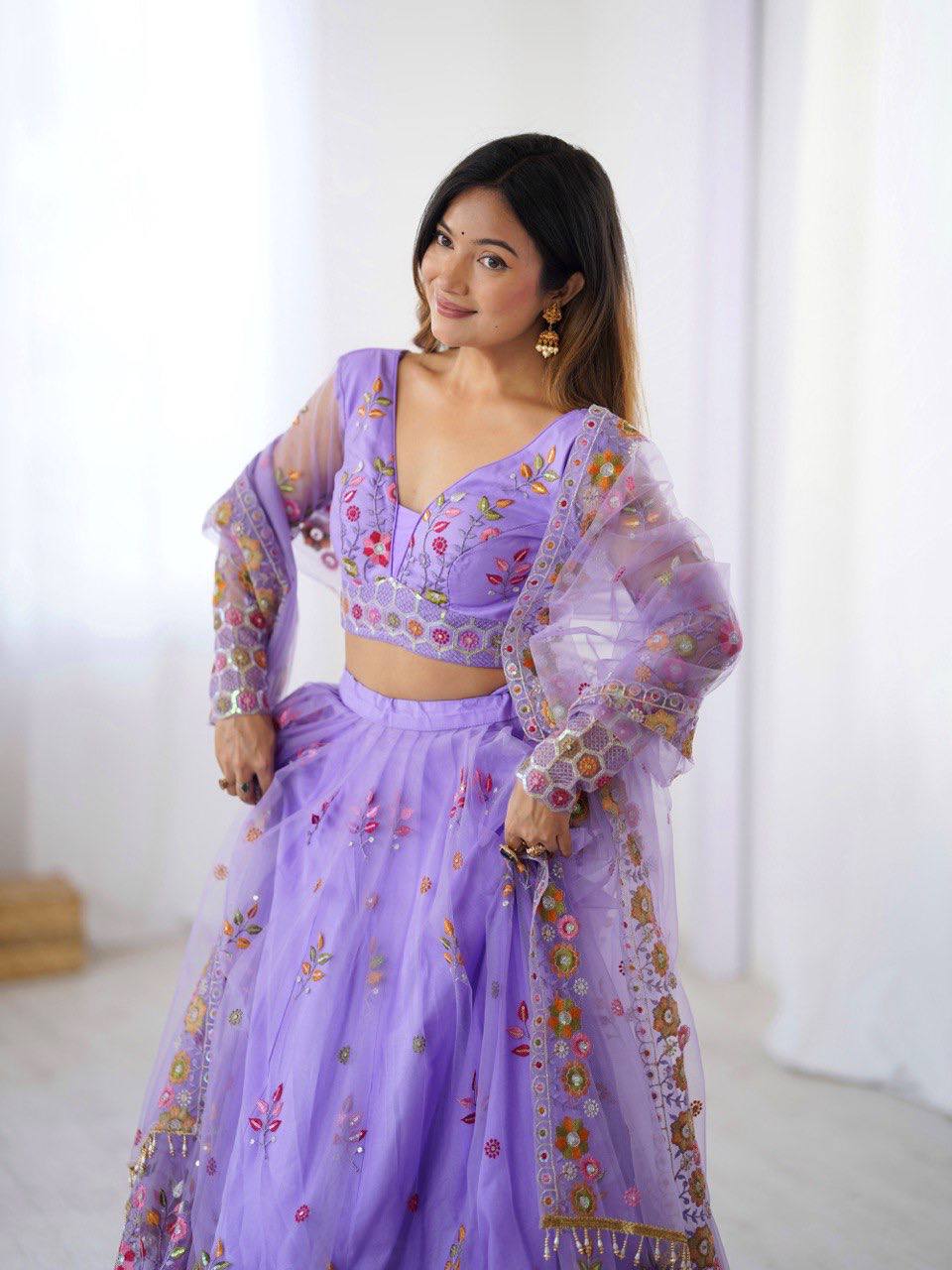 Party Wear Lavender Soft Net Intricate Thread And Sequin Embroidery Work Beautiful Lehenga Choli