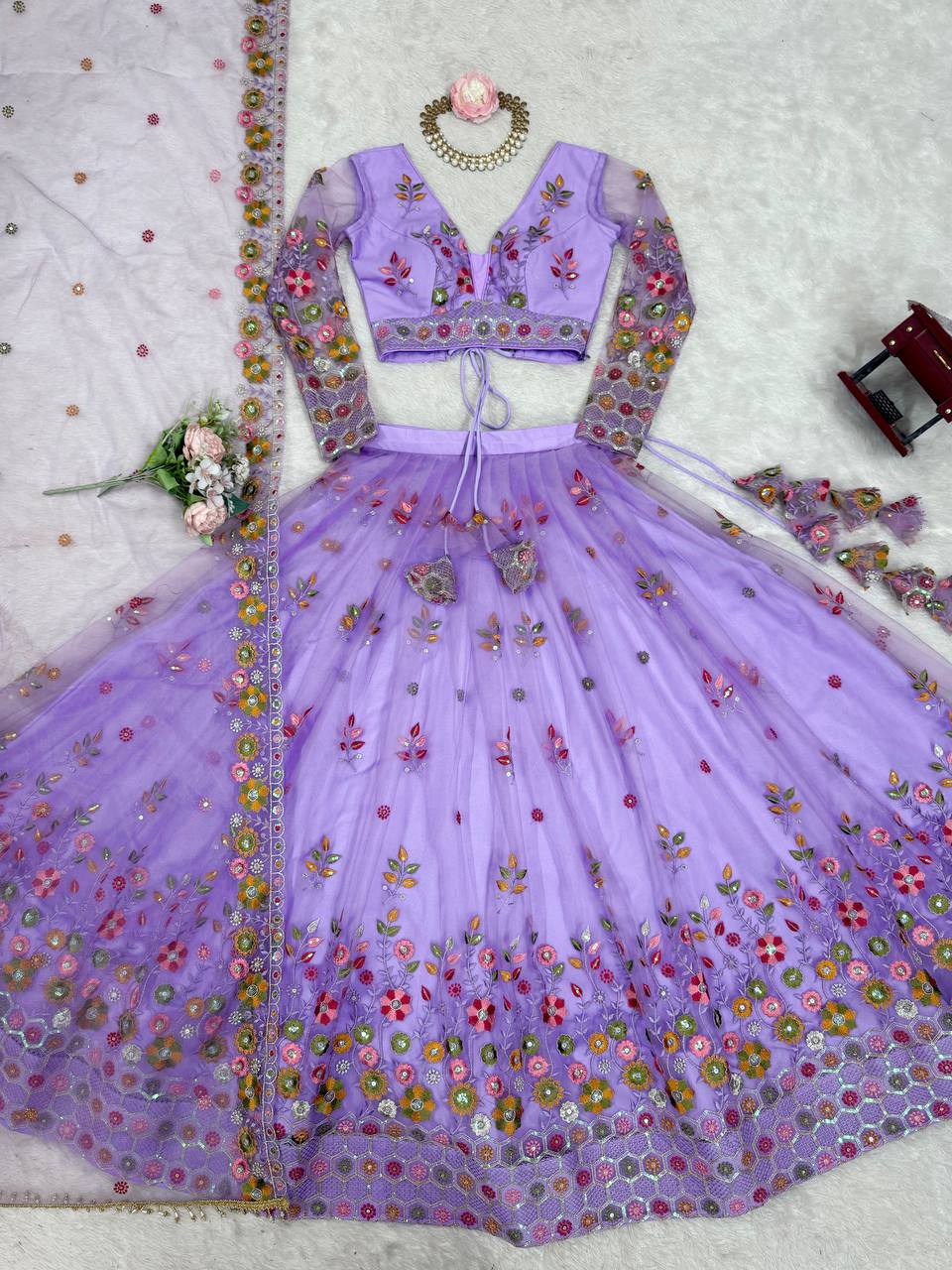 Party Wear Lavender Soft Net Intricate Thread And Sequin Embroidery Work Beautiful Lehenga Choli