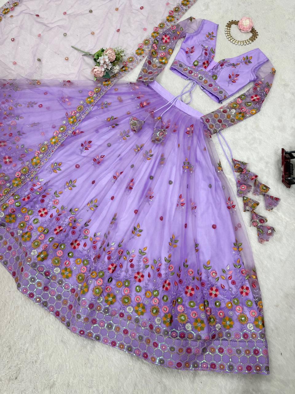 Party Wear Lavender Soft Net Intricate Thread And Sequin Embroidery Work Beautiful Lehenga Choli