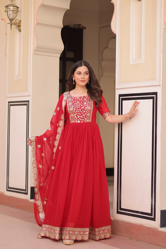 Engagement Wear Red Color Faux Blooming Fabric Adorned With Rich Embroidery Zari And Sequin Work Gown
