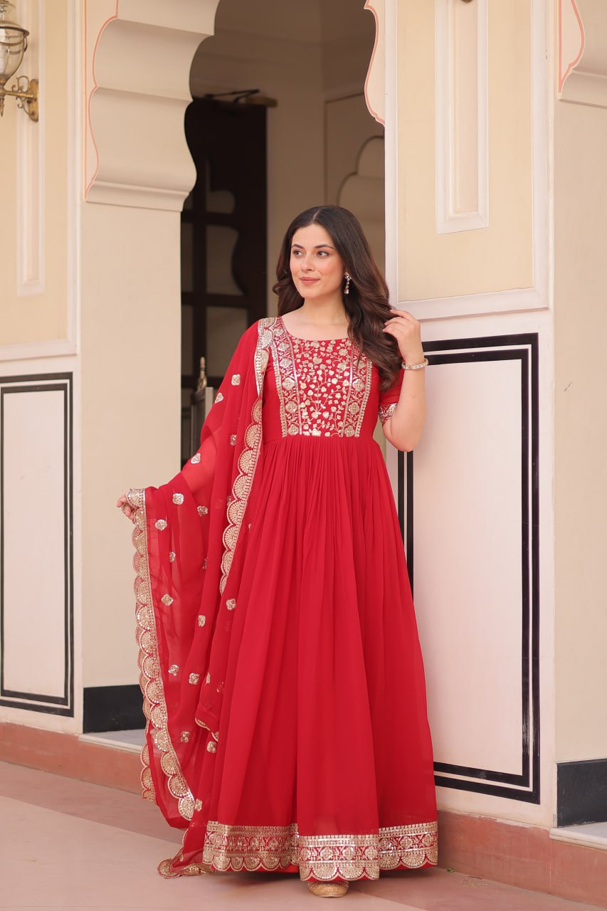 Engagement Wear Red Color Faux Blooming Fabric Adorned With Rich Embroidery Zari And Sequin Work Gown