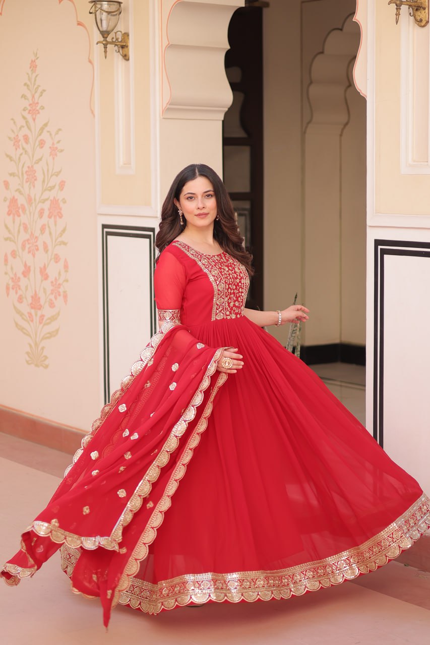 Engagement Wear Red Color Faux Blooming Fabric Adorned With Rich Embroidery Zari And Sequin Work Gown