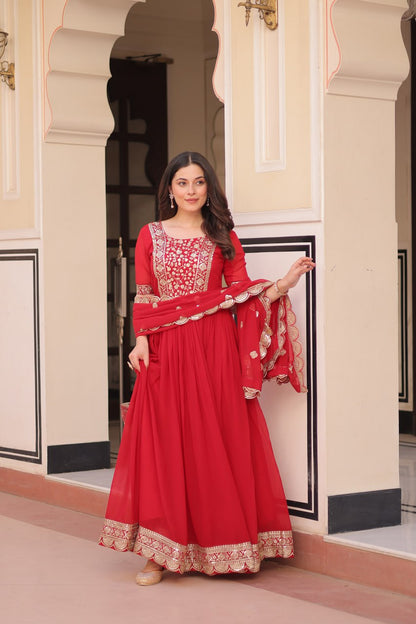 Engagement Wear Red Color Faux Blooming Fabric Adorned With Rich Embroidery Zari And Sequin Work Gown