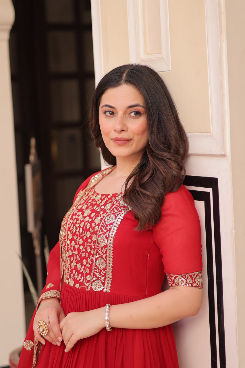 Engagement Wear Red Color Faux Blooming Fabric Adorned With Rich Embroidery Zari And Sequin Work Gown