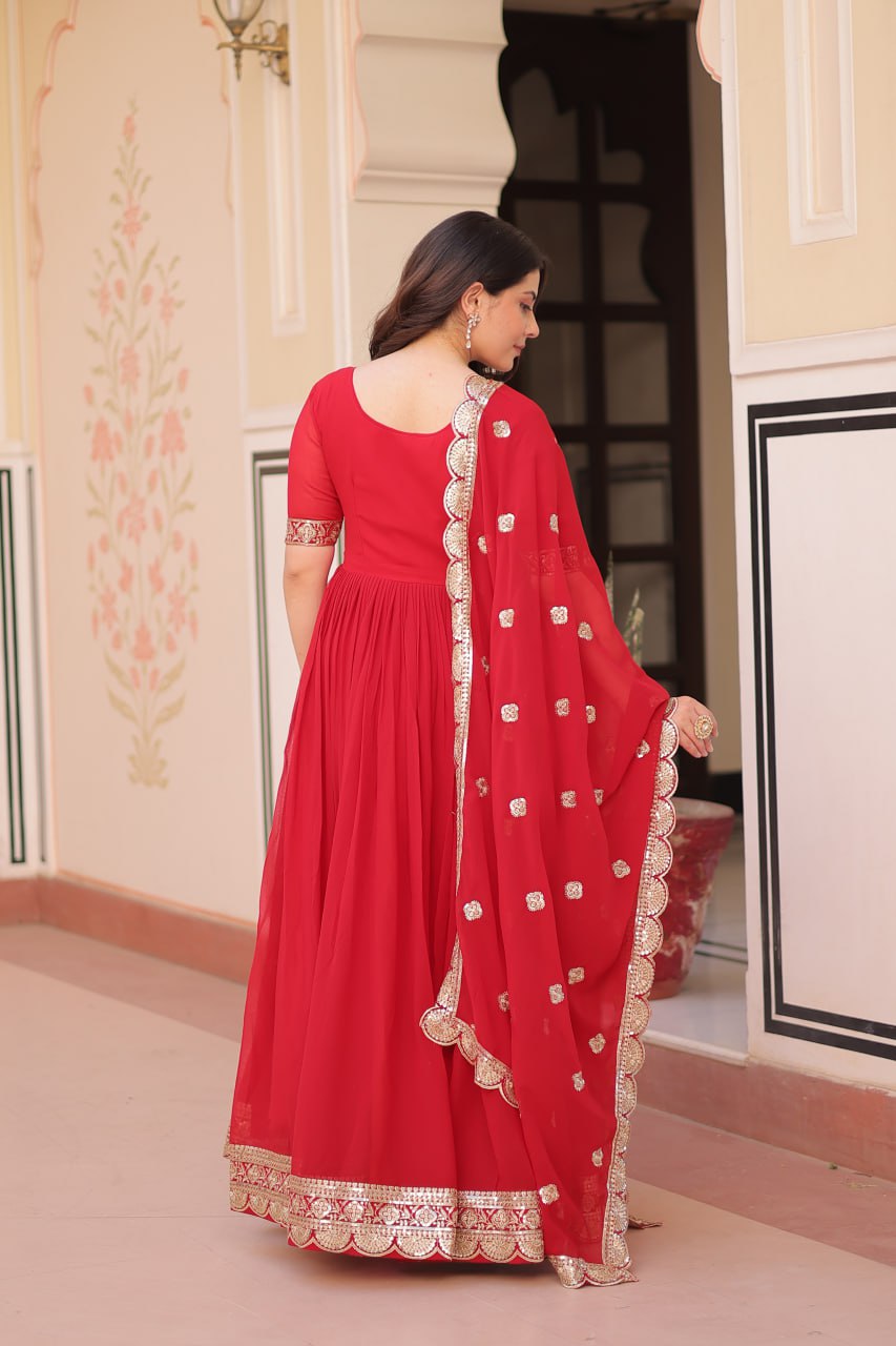 Engagement Wear Red Color Faux Blooming Fabric Adorned With Rich Embroidery Zari And Sequin Work Gown