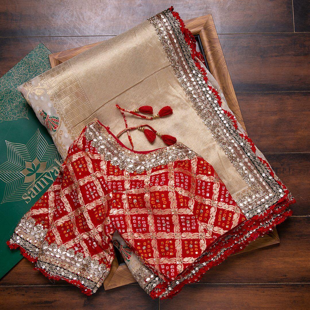 Classy Off White Saree With Red Bandhani Blouse