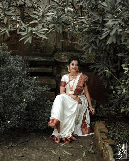 Opulent White Color Soft Lichi Silk Golden Zari Saree