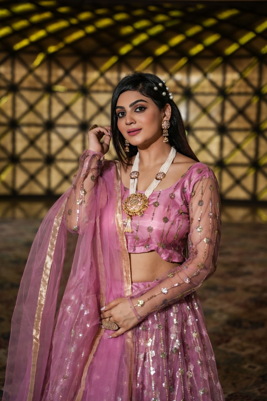 Pretty Peach Color Embroidery Work Net Lehenga Choli