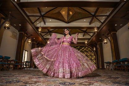 Pretty Peach Color Embroidery Work Net Lehenga Choli