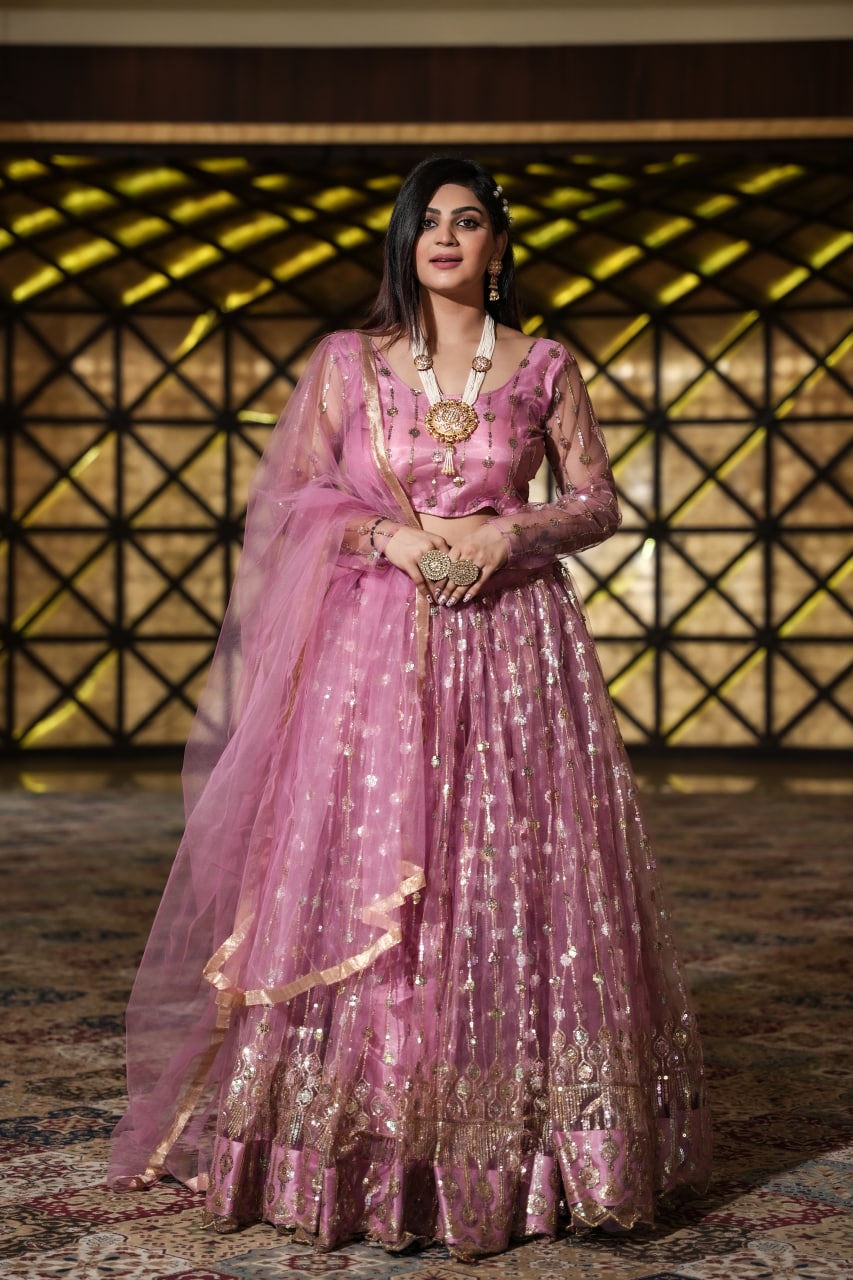 Pretty Peach Color Embroidery Work Net Lehenga Choli