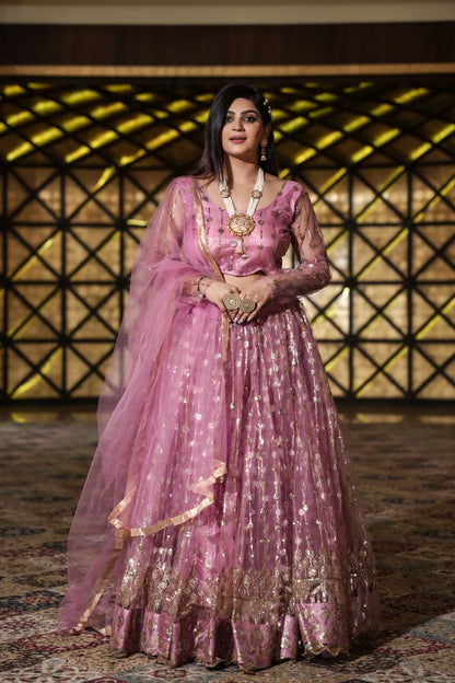 Pretty Peach Color Embroidery Work Net Lehenga Choli