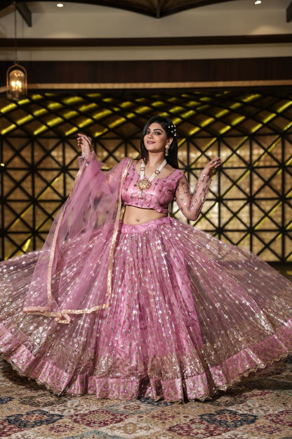 Pretty Peach Color Embroidery Work Net Lehenga Choli