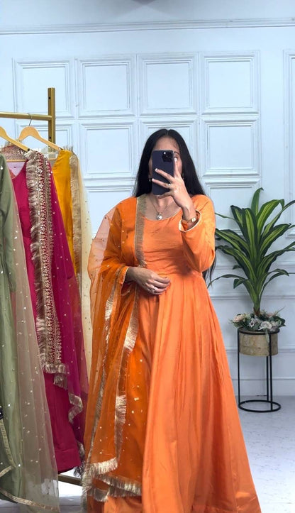 Orange Color Plain Gown With Work Net Dupatta