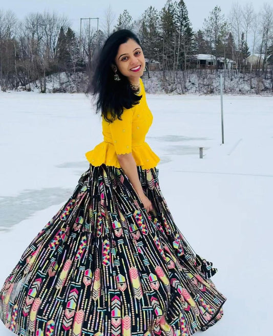 Trendy Yellow Color Top With Printed Black Lehenga