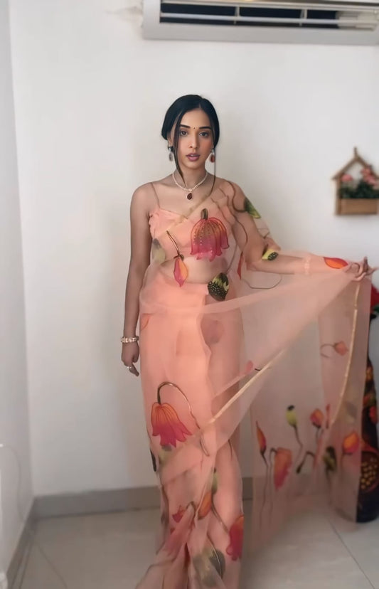 Exotic  Flowers Design Peach Color Saree