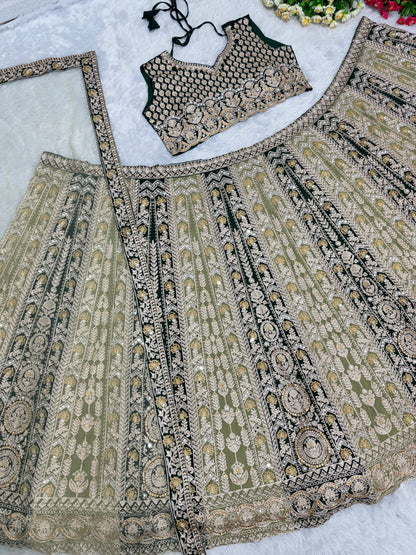 Pretty Pista With Black Mirror Hand Work Lehenga Choli