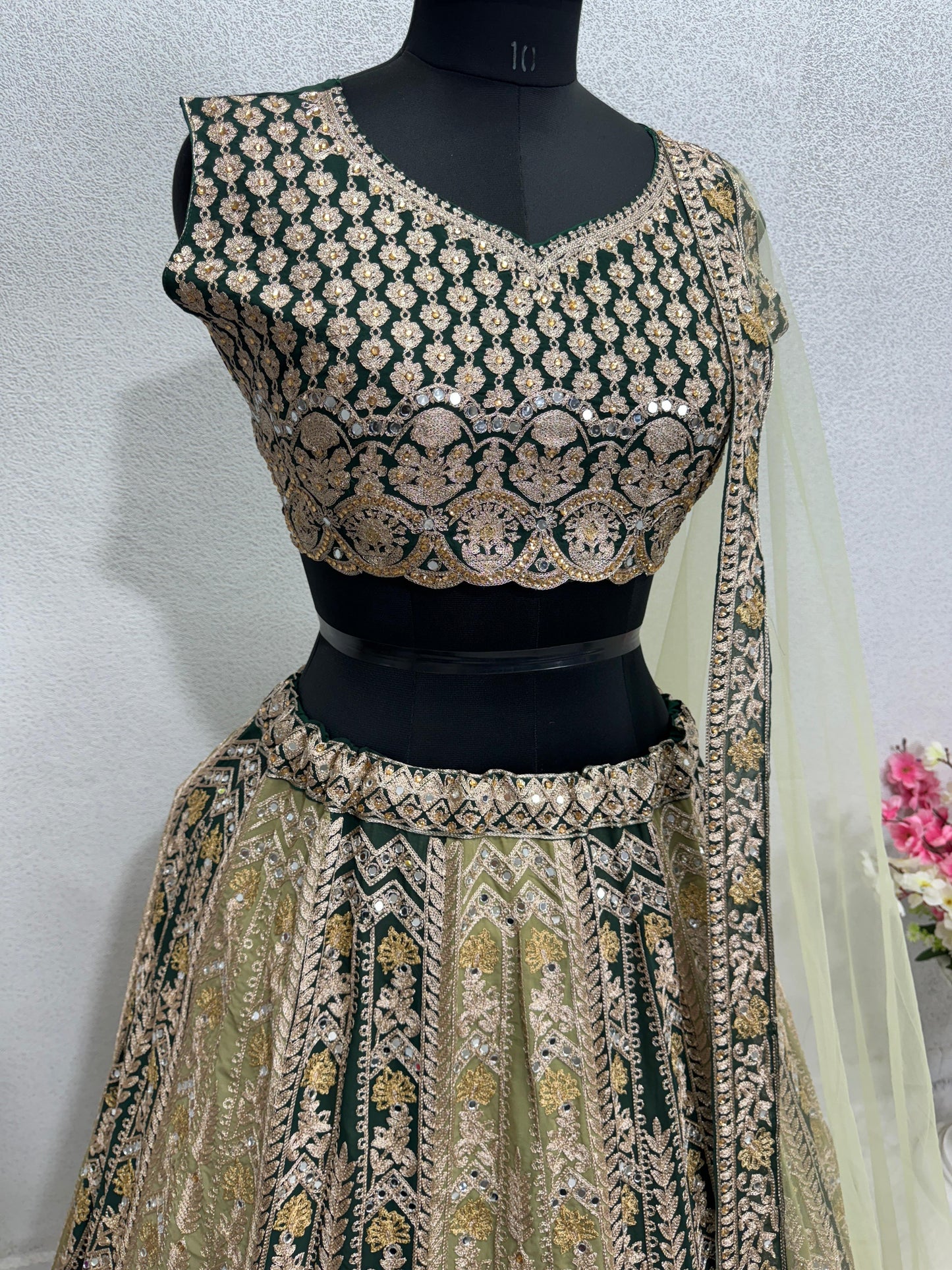 Pretty Pista With Black Mirror Hand Work Lehenga Choli